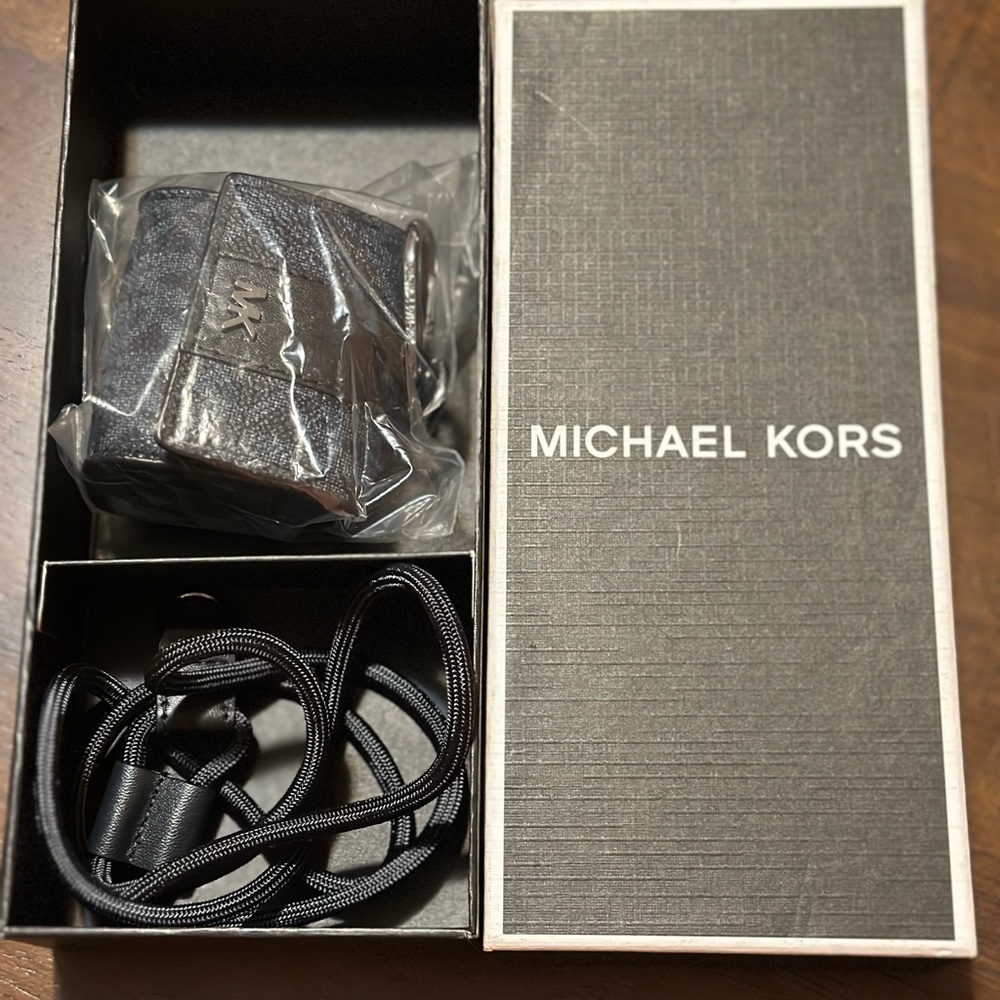 Brand new out of the box MK ear buds case holder!
